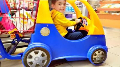 Alex going Shopping Driving Cozy Coupe Trolley